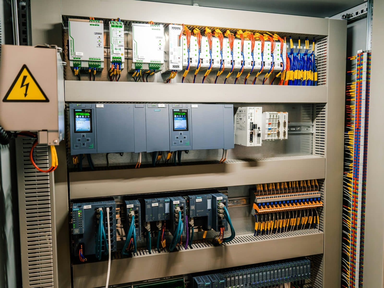 Control cabinet with PLC modules, power supplies and terminal blocks